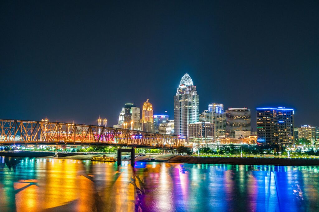 pexels photo 2570704 2570704 Captivating view of Cincinnati skyline with bridge reflections on Ohio River at night.